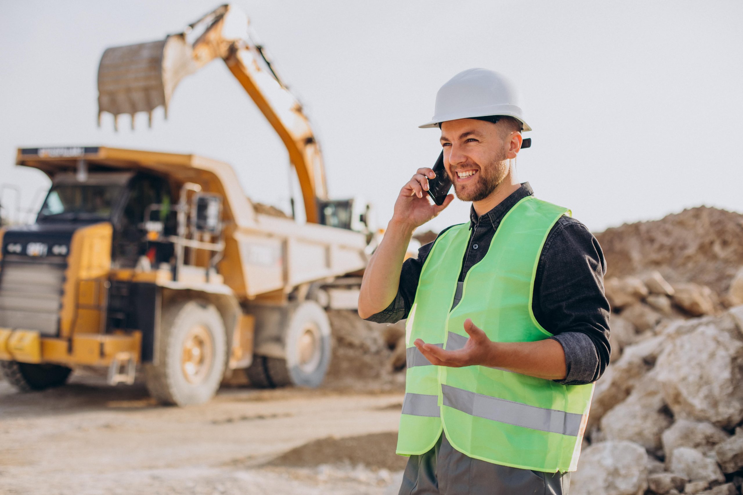 male-worker-with-bulldozer-sand-quarry-min-scaled.jpg